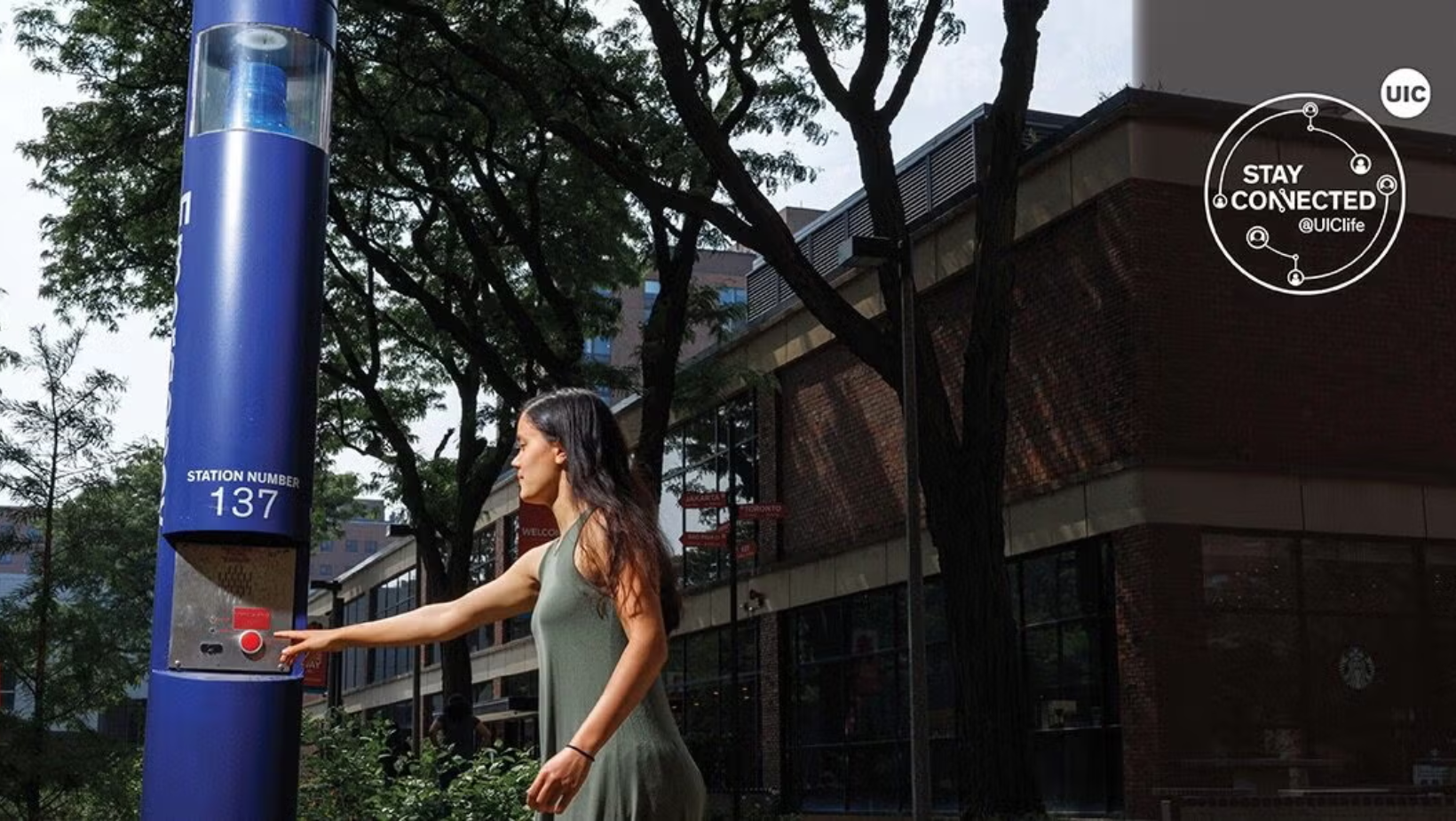 Campus blue light emergency telephone station mounted on an outdoor pole