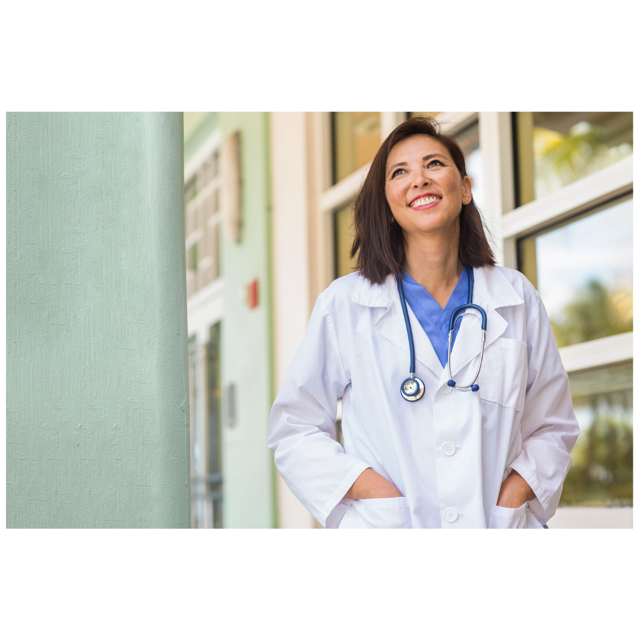 Doctor and clinical team coordinating patient care with digital communication devices
